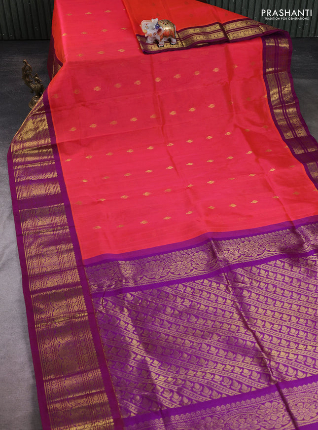 Silk cotton saree dual shade of pinkish orange and purple with allover zari woven buttas and long zari woven korvai border