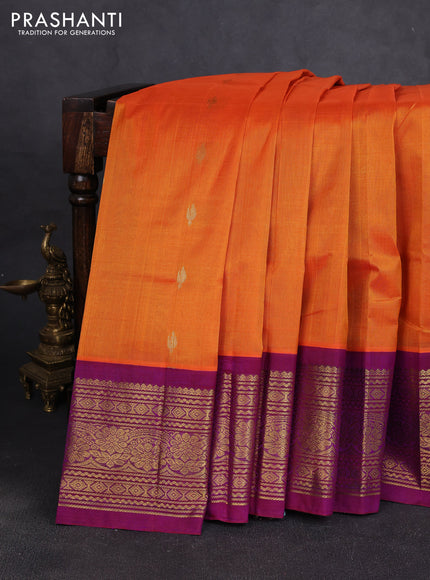 Silk cotton saree orange and purple with allover zari woven buttas and long zari woven korvai border