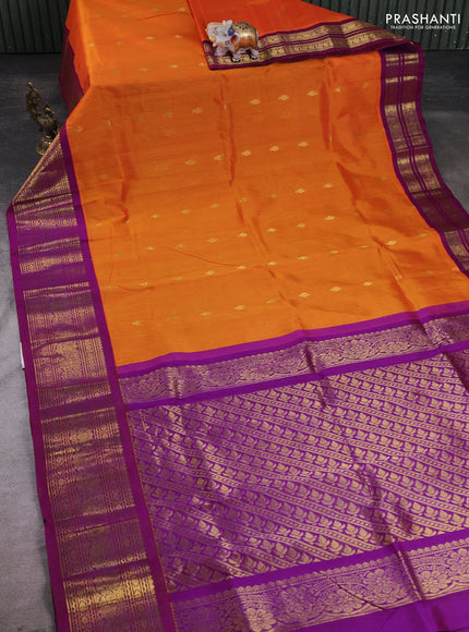 Silk cotton saree orange and purple with allover zari woven buttas and long zari woven korvai border