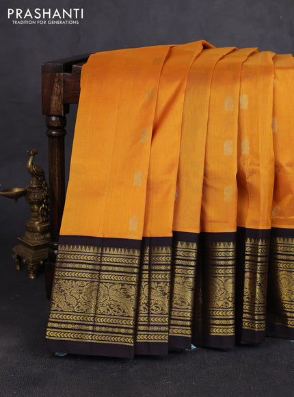 Silk cotton saree mustard yellow and black with annam zari woven buttas and long zari woven korvai border