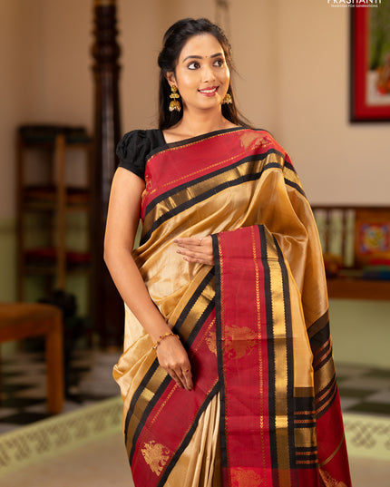 Silk cotton saree sandal and black with plain body and rettapet zari woven butta korvai border