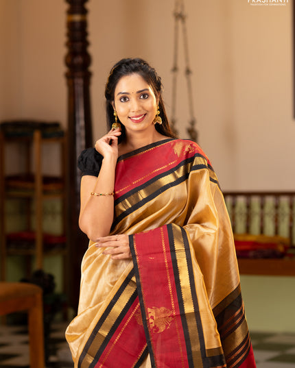 Silk cotton saree sandal and black with plain body and rettapet zari woven butta korvai border