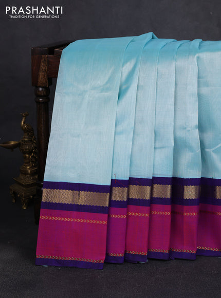 Silk cotton saree light teal blue and royal blue with plain body and rettapet zari woven butta korvai border