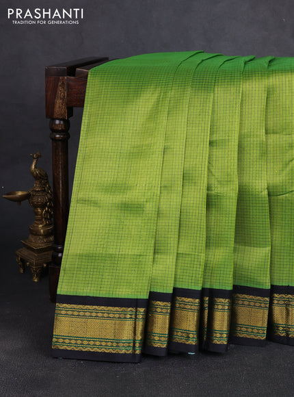 Silk cotton saree green and black with allover small checked pattern and zari woven korvai border