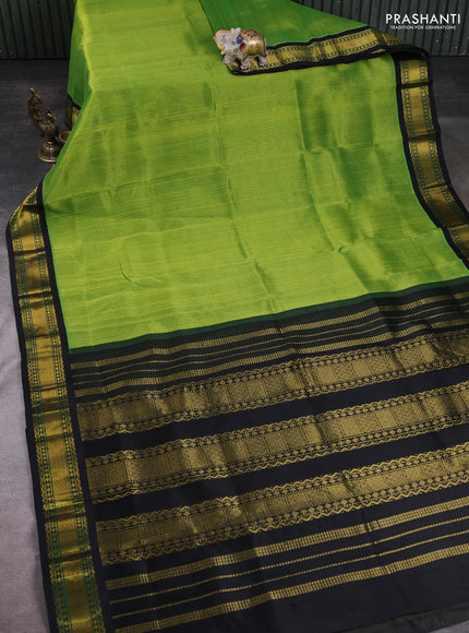 Silk cotton saree green and black with allover small checked pattern and zari woven korvai border