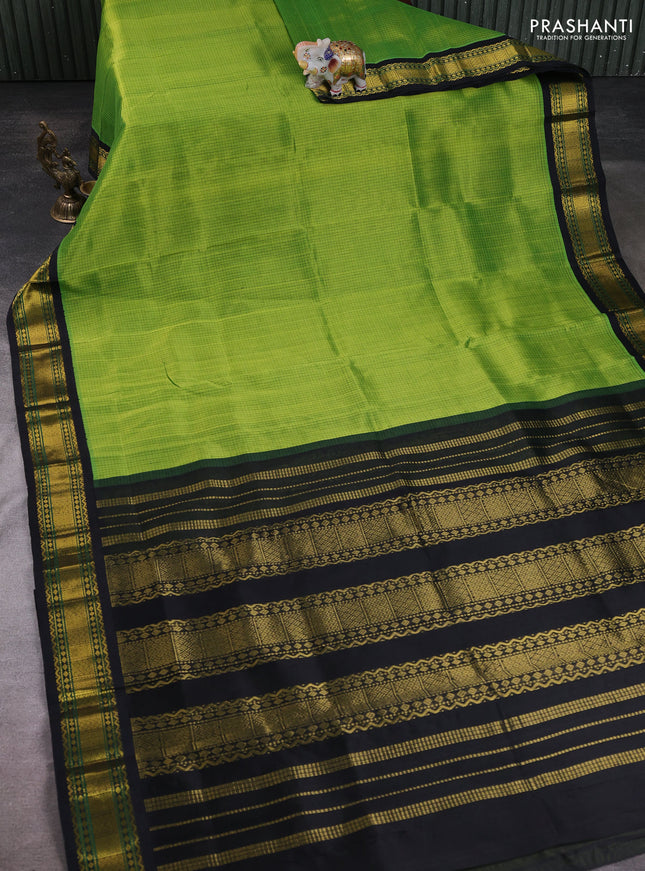 Silk cotton saree green and black with allover small checked pattern and zari woven korvai border