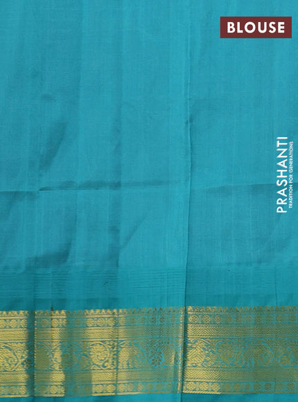 Silk cotton saree purple and pastel blue with allover zari checks & buttas and temple design zari woven korvai border
