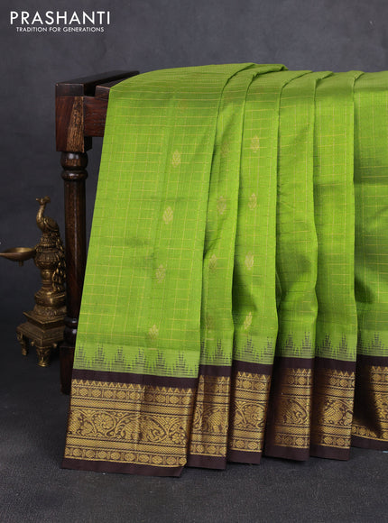 Silk cotton saree light green and coffee brown with allover zari checks & buttas and temple design zari woven korvai border