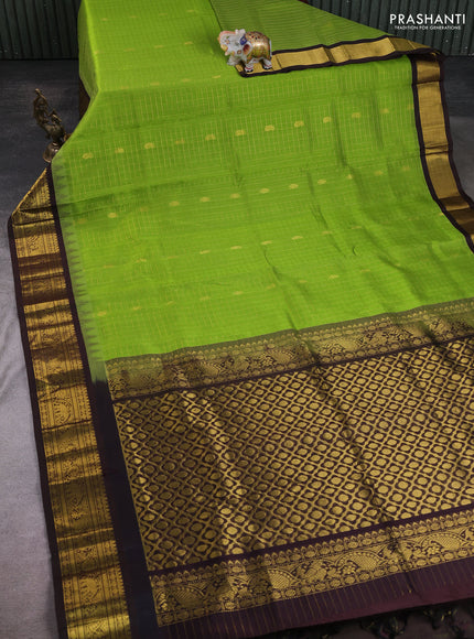 Silk cotton saree light green and coffee brown with allover zari checks & buttas and temple design zari woven korvai border
