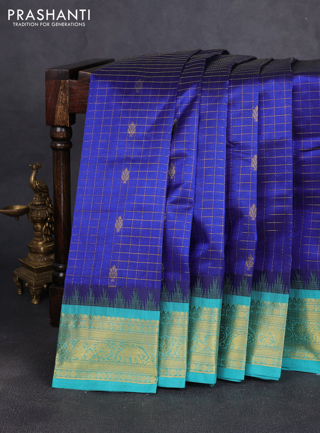 Silk cotton saree blue shade and teal blue with allover zari checks & buttas and temple design zari woven korvai border