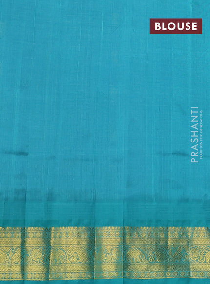 Silk cotton saree blue shade and teal blue with allover zari checks & buttas and temple design zari woven korvai border