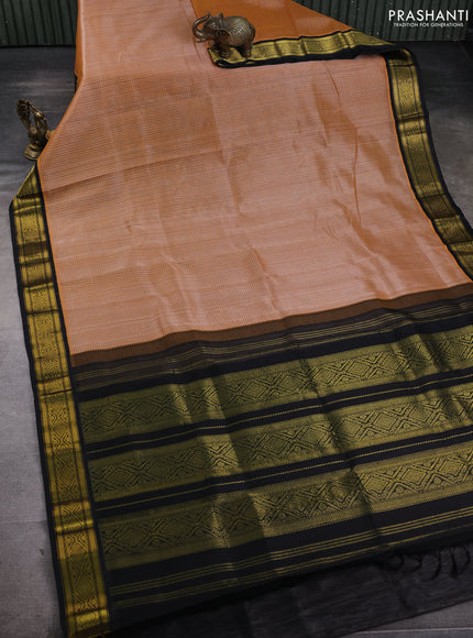 Silk cotton saree pale orange and black with allover checked pattern and zari woven korvai border