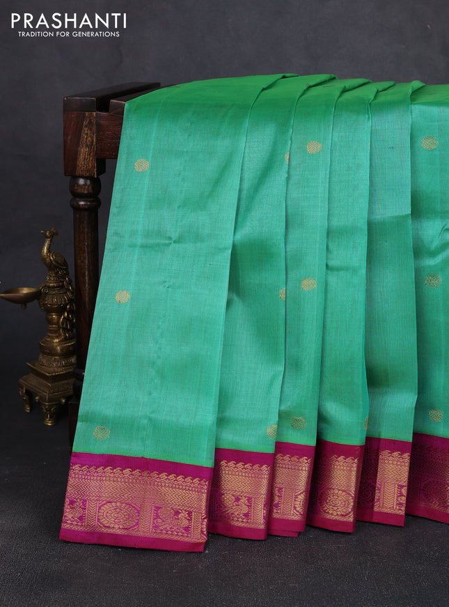 Silk cotton saree teal green and purple with allover rudhraksha zari woven buttas and zari woven korvai border