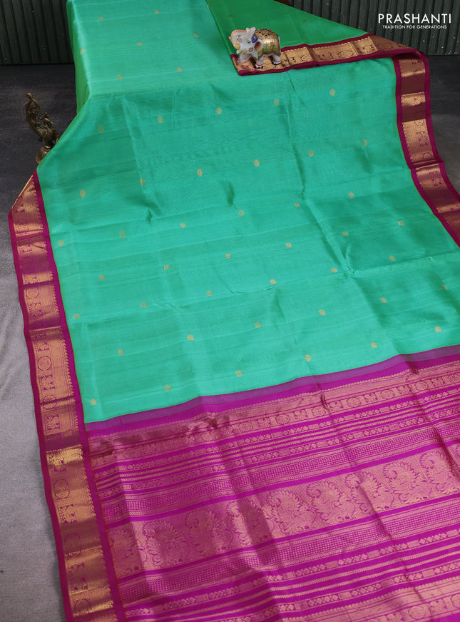 Silk cotton saree teal green and purple with allover rudhraksha zari woven buttas and zari woven korvai border