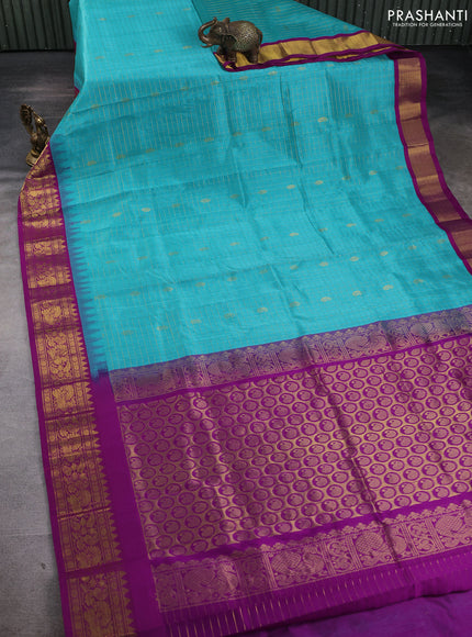 Silk cotton saree teal blue and purple with allover zari checks & buttas and temple design zari woven korvai border