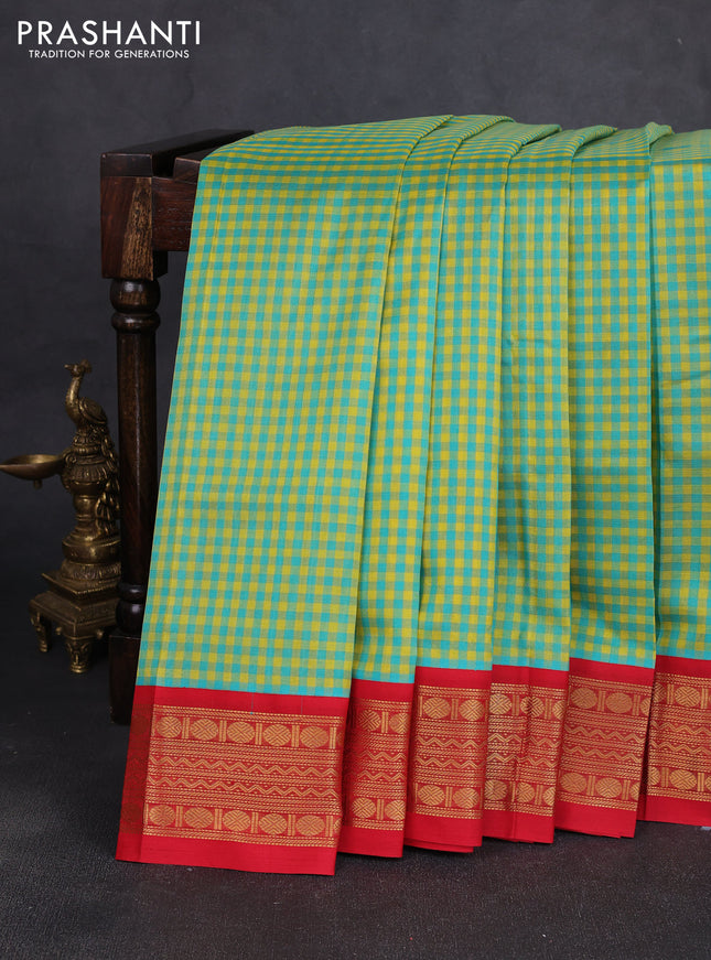 Silk cotton saree teal blue & yellow and red with allover zari checks & paisley buttas and zari woven korvai border