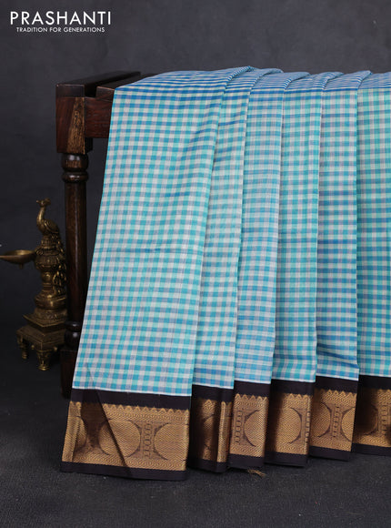 Silk cotton saree blue shade and coffee brown with allover checked pattern and rudhraksha zari woven korvai border