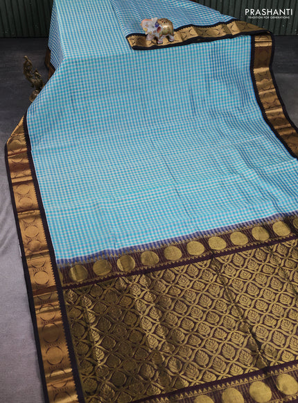 Silk cotton saree blue shade and coffee brown with allover checked pattern and rudhraksha zari woven korvai border