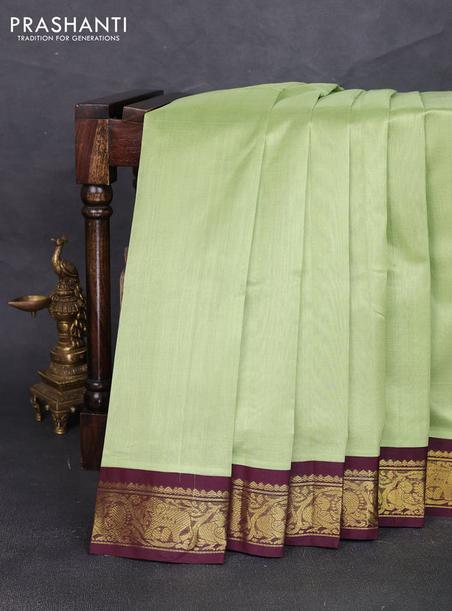 Silk cotton saree pista green and deep maroon with plain body and zari woven border