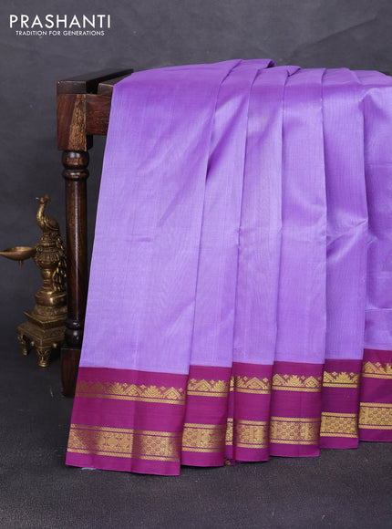 Silk cotton saree lavender and deep purple with plain body and rettapet zari woven korvai border