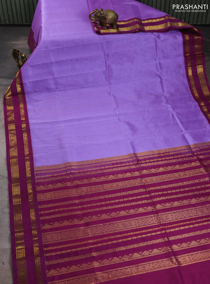 Silk cotton saree lavender and deep purple with plain body and rettapet zari woven korvai border