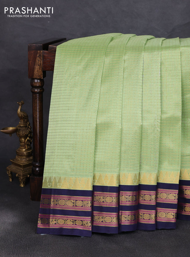 Silk cotton saree pista green and navy blue with allover zari checked pattern and temple zari woven korvai border