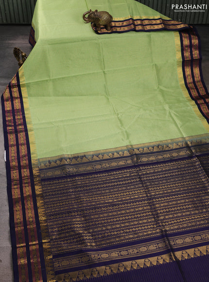 Silk cotton saree pista green and navy blue with allover zari checked pattern and temple zari woven korvai border