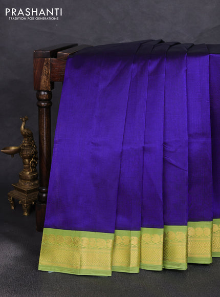 Silk cotton saree violet and light green with plain body and zari woven korvai border