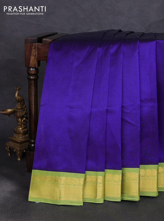 Silk cotton saree violet and light green with plain body and zari woven korvai border