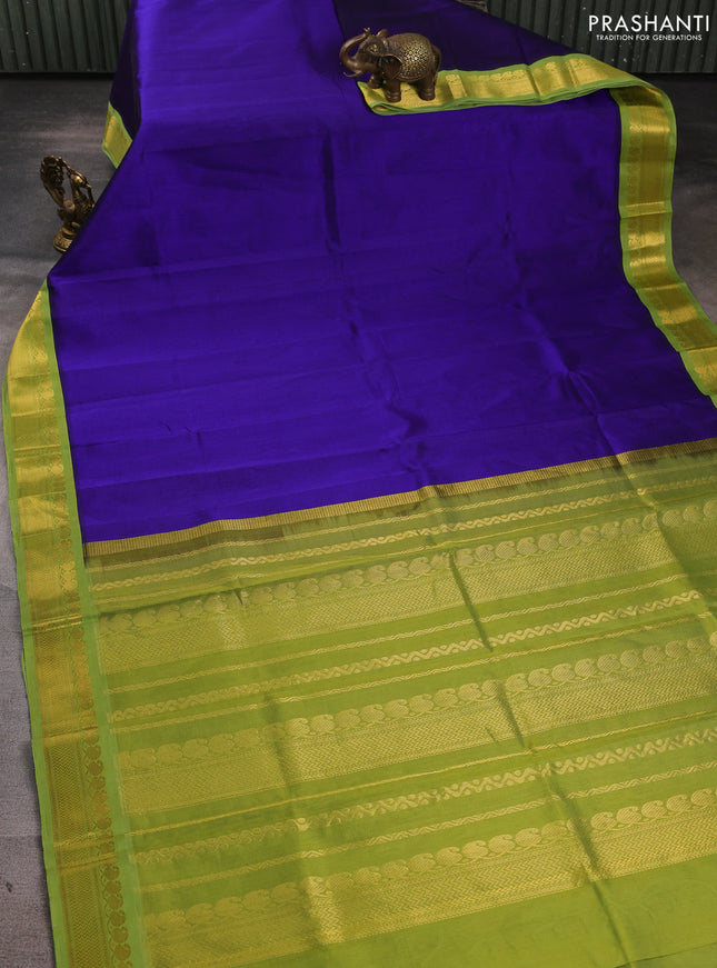 Silk cotton saree violet and light green with plain body and zari woven korvai border