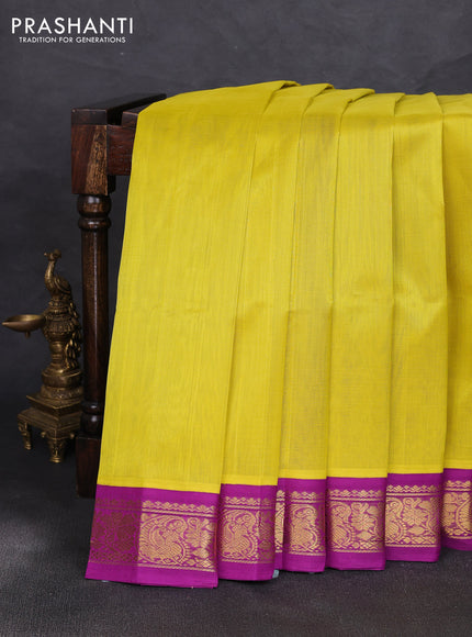Silk cotton saree yellow and purple with plain body and zari woven korvai border