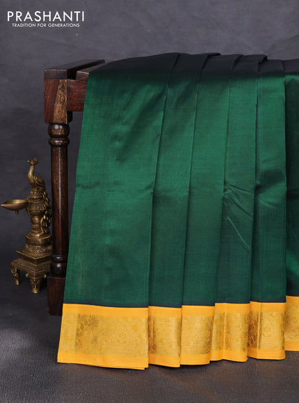 Silk cotton saree green and yellow with plain body and zari woven korvai border