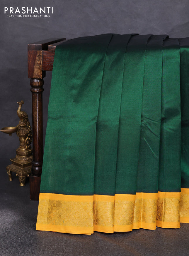 Silk cotton saree green and yellow with plain body and zari woven korvai border