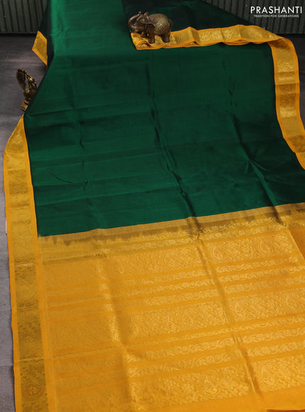 Silk cotton saree green and yellow with plain body and zari woven korvai border