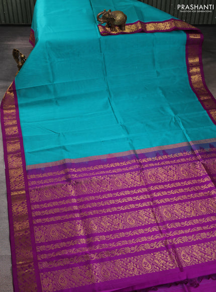 Silk cotton saree teal blue and purple with plain body and zari woven korvai border