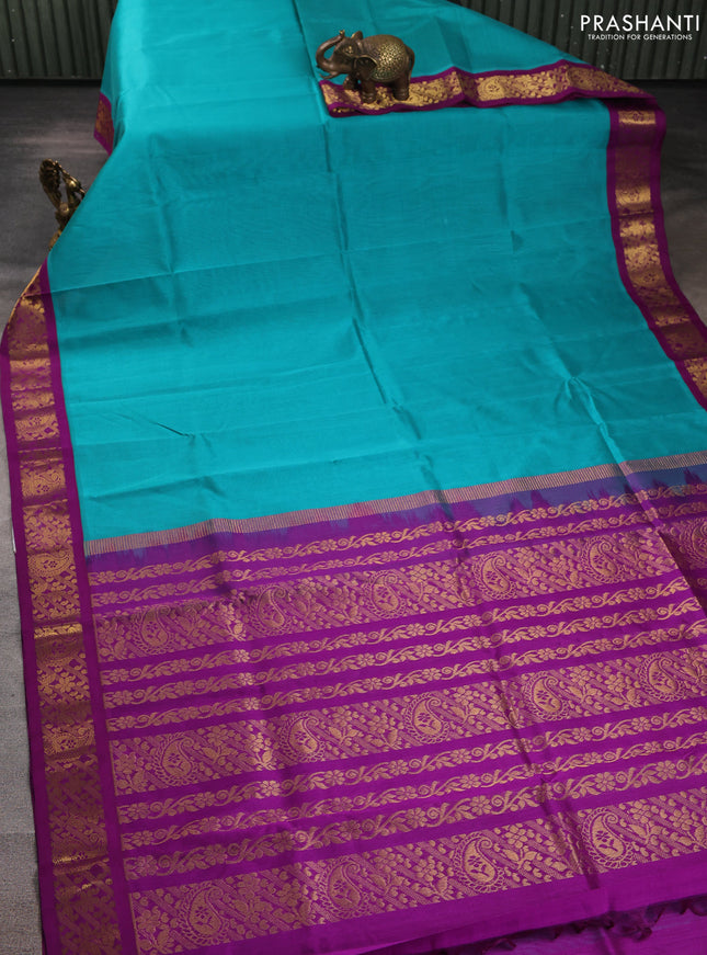 Silk cotton saree teal blue and purple with plain body and zari woven korvai border