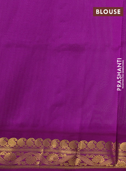 Silk cotton saree pista green and purple with plain body and zari woven korvai border