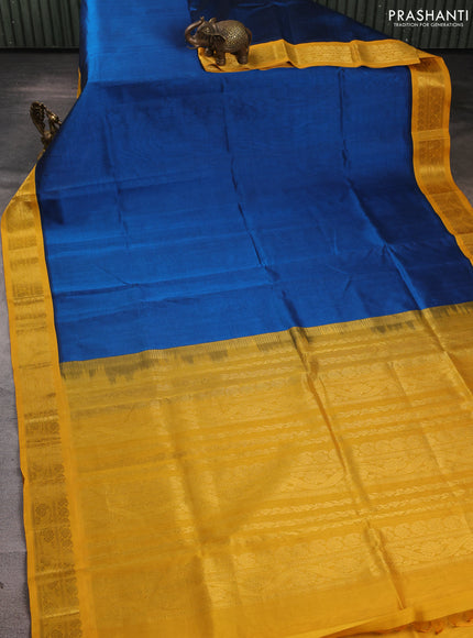 Silk cotton saree peacock blue and yellow with plain body and zari woven korvai border
