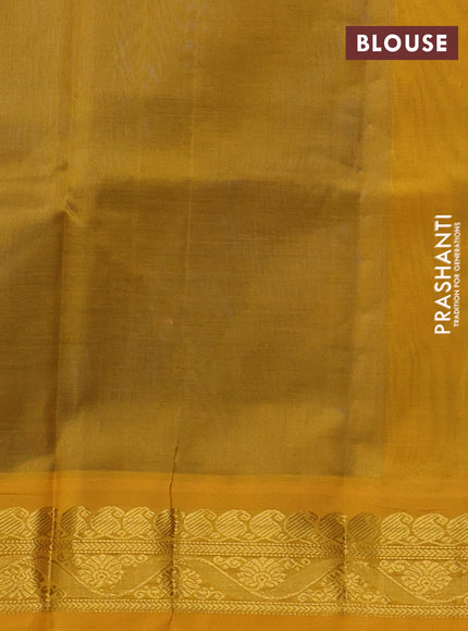 Silk cotton saree peacock blue and yellow with plain body and zari woven korvai border
