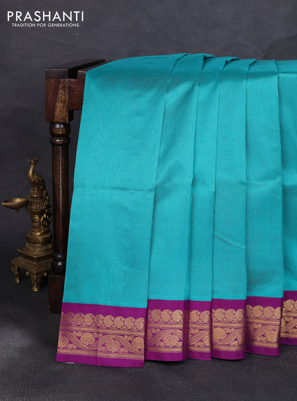Silk cotton saree teal blue and purple with plain body and zari woven korvai border