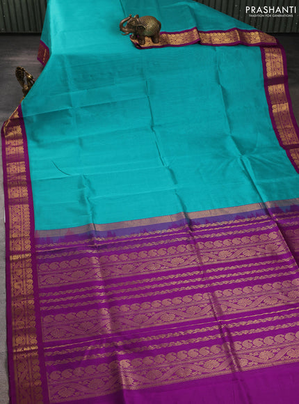 Silk cotton saree teal blue and purple with plain body and zari woven korvai border