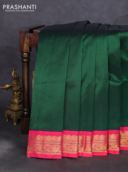 Silk cotton saree bottle green and pink with plain body and zari woven korvai border