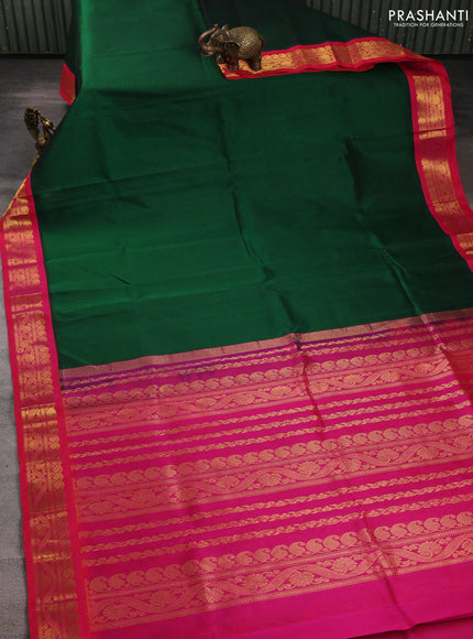 Silk cotton saree bottle green and pink with plain body and zari woven korvai border