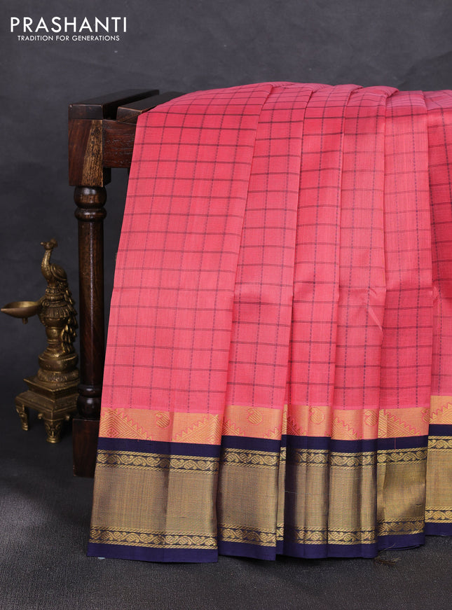 Silk cotton saree peach pink and navy blue with allover small checked pattern and temple zari woven korvai border