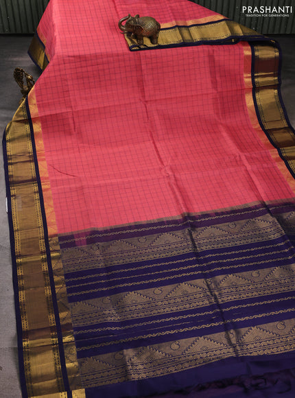 Silk cotton saree peach pink and navy blue with allover small checked pattern and temple zari woven korvai border