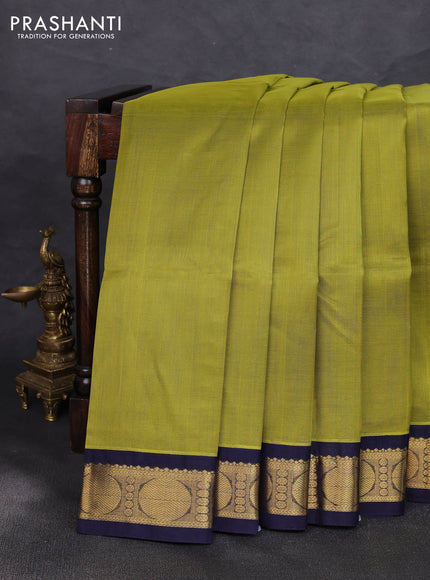 Silk cotton saree mehendi green and navy blue with plain body and rudraksha zari woven korvai border