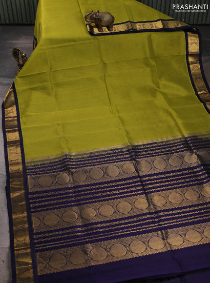 Silk cotton saree mehendi green and navy blue with plain body and rudraksha zari woven korvai border