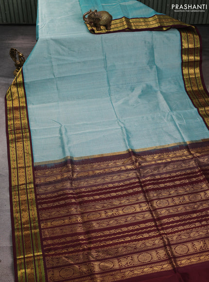 Silk cotton saree teal blue and deep maroon with allover small checked pattern and zari woven korvai border