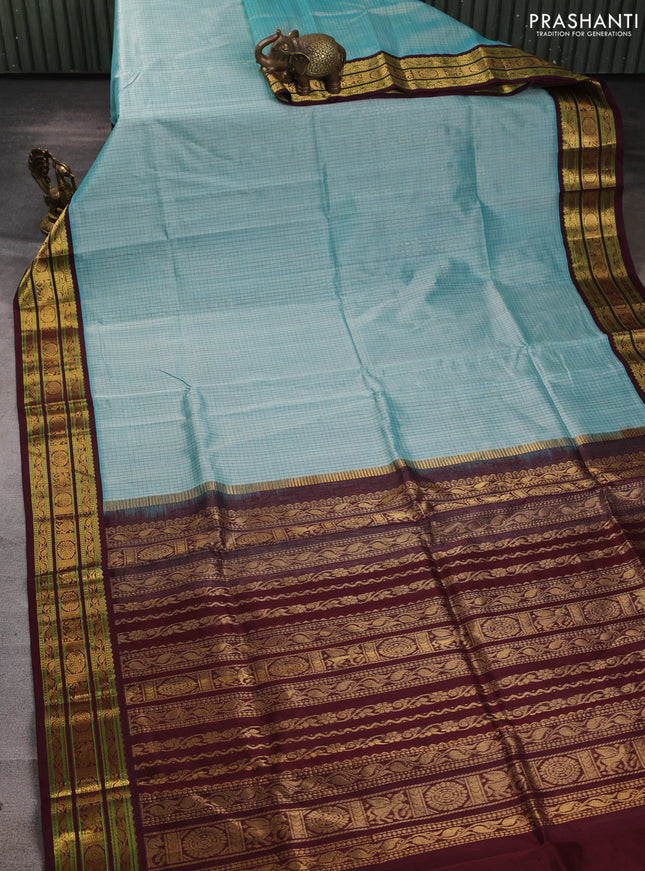 Silk cotton saree teal blue and deep maroon with allover small checked pattern and zari woven korvai border