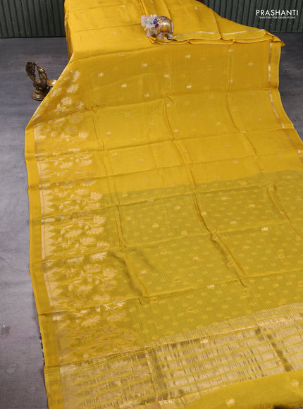 Art kota silk saree mustard yellow and bottle green with allover zari woven buttas and floral zari woven border